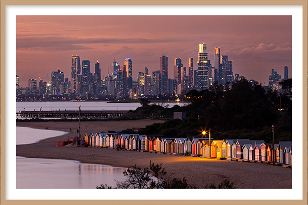 Brighton Bathing Boxes image at dusk with Melbourne CBD in the background with a oak frame