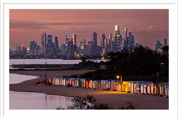 Brighton Bathing Boxes image at dusk with Melbourne CBD in the background with a white frame